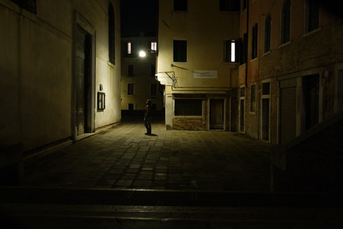 Nighttime staring at a street sign in Cannareggio