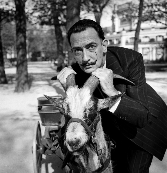 FRANCE - CIRCA 1953: Salvador Dali With A Goat In Paris, France In 1953 (Photo by REPORTERS ASSOCIES/Gamma-Rapho via Getty Images)