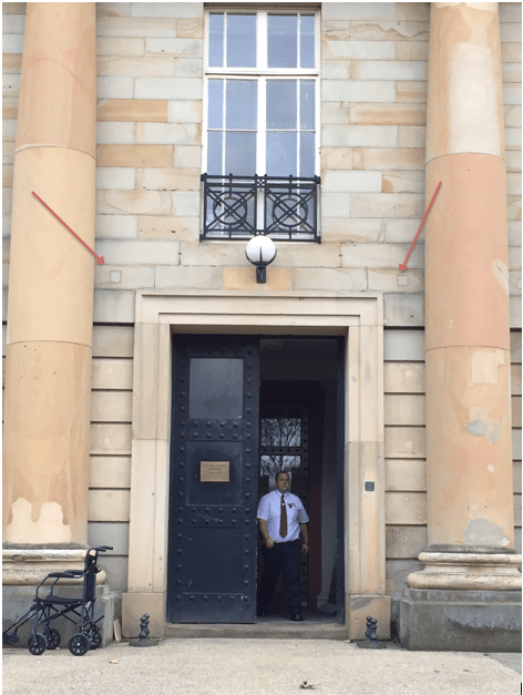 Durham Crown Court entrance. Directly above the door to the right and left you can see two, small block squares (marked by red arrows). These were the holes for the beam supports for the scaffold. A macabre reminder, to all who enter, of the punishments their criminal forebears may have faced. The window above the door was the point from which the condemned would step out from onto the platform, as described in the executions below