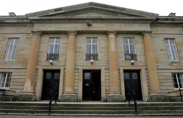 Modern Day Durham Crown Court. The building frontage appears entirely in fitting with the descriptions of executions from 1816 onwards. The square stone pegs where the scaffold supports sat still visible to the top left and top right of the central black door.